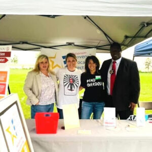 RAP-WI members Amy Anderson, Jessica Geschke, Jill Whitmarsh, and Dane County Sheriff Kalvin Barrett showed support for Wisconsin recovery in September at the Overdose Awareness Day Remembrance event at Olbrich Park.